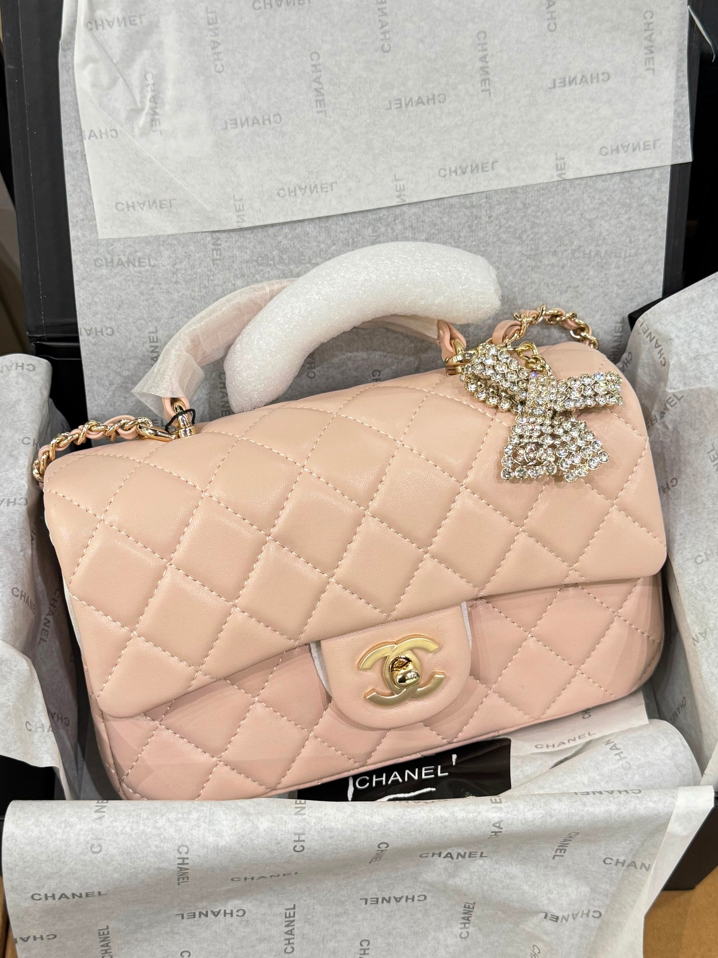 CHANEL Premium Quilted Mini Top Handle Flap Bag with Crystal Bow Charm